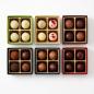 Preview: Verpackung für 4 Pralinen bunt, alle Farben